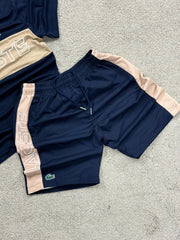 Conjunto Lacoste dorado